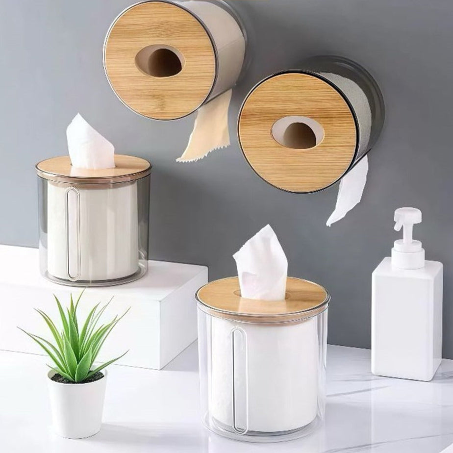 Porta papel higiênico transparente com tampa de bambu em diferentes posições, usado como suporte de parede e dispenser de lenços.
