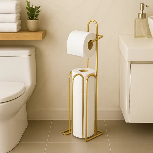 Suporte de papel higiênico de chão dourado com porta-rolos e compartimento para rolos reserva.