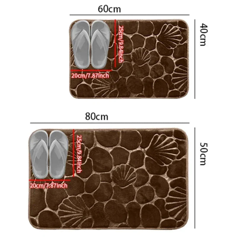 Tapete Conchas marrom antiderrapante, perfeito para diferentes ambientes da casa, suas dimensões de 60cm x 40cm e 80cm x 50cm.